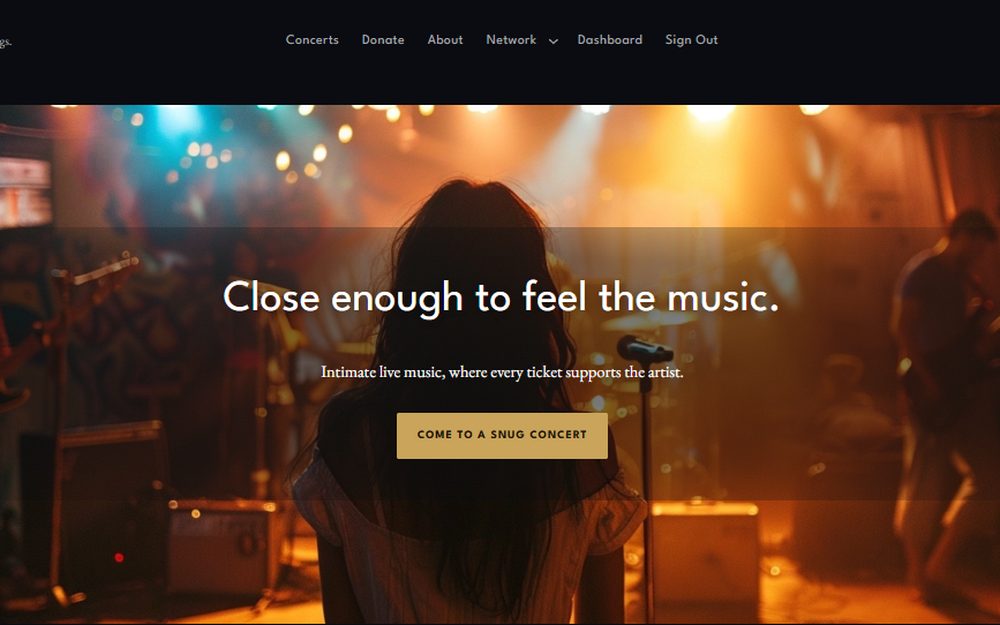 Snug Concerts website homepage showing a live music stage
